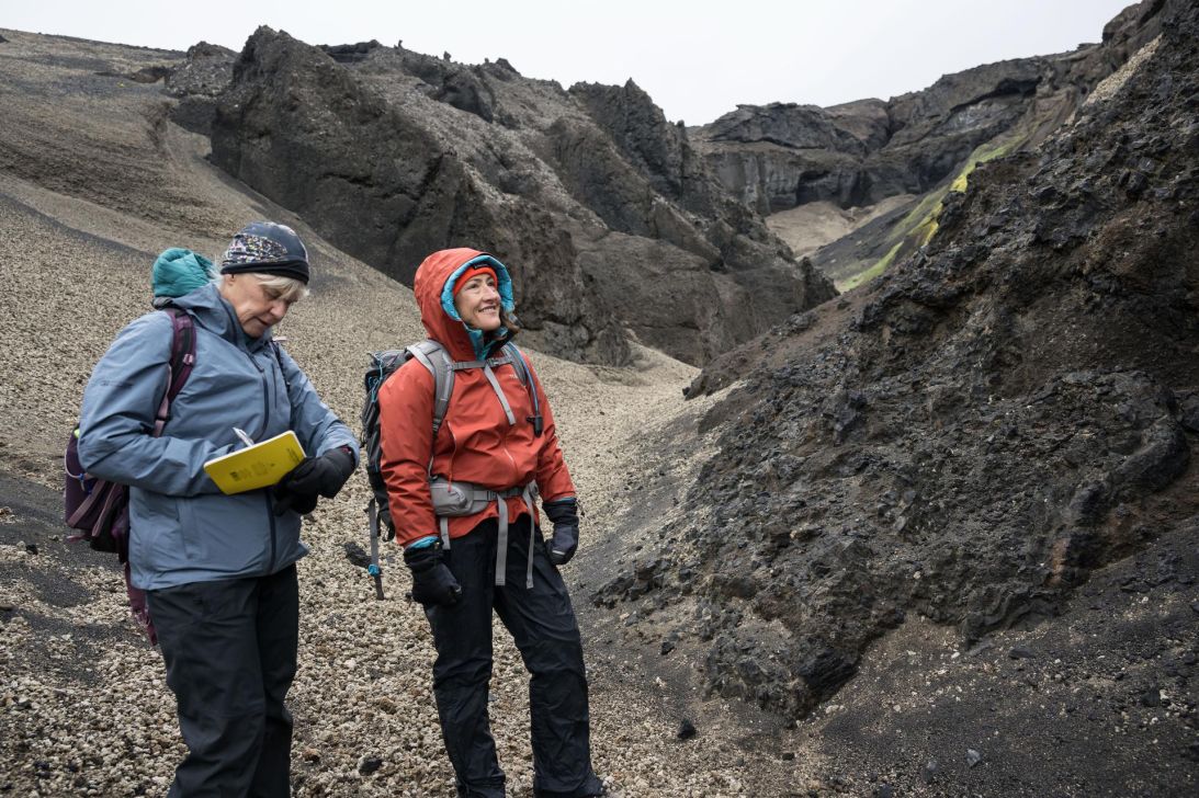 NASA's Artemis geology training lead Cindy Evans (left) and Artemis II astronaut Christina Koch study moonlike geologic features in Iceland.